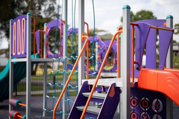 Playground inspections of colourful outdoor play equipment to help maintain a safe and well-maintained play area.